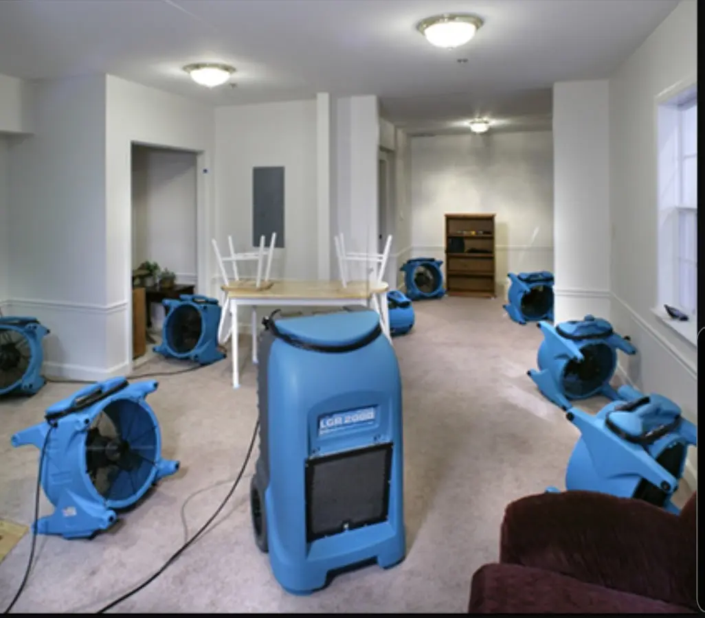 Air movers and dehumidifier setup for Water Damage Restoration in Clute